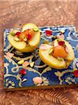 Lebanese-style apples filled with apricots and ginger,rose and pistachio sauce