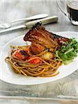 Caramelized spaghetti and shoulder of lamb with honey and tomatoes