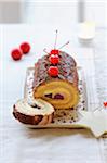 Chocolate and cherry rolled log cake