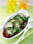 Courgettes stuffed with fromage frais on a bed of tomatoes