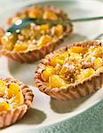 Pink biscuit and apricot tartlets