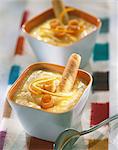 Orange cream dessert with Cigarette Russe rolled biscuits