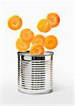 Sliced carrots falling in a can