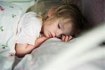 Toddler sleeping in bed