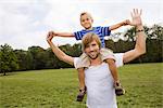 Father carrying son on shoulders, Munich, Bavaria, Germany