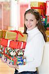 Happy teenage girl with Christmas presents, Munich, Bavaria, Germany