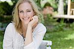 Smiling woman sitting outdoors