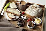 Breakfast tray of bread, jam and coffee