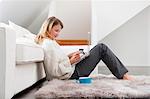 Woman shopping online in living room