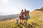 Family hiking together on hillside