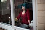 Disappointed woman standing in kitchen