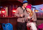 Couple having coffee together at cafe