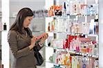 Businesswoman Shopping for Perfume at Duty-Free Shop