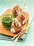 Raw ham and cream cheese rolls with herb sauce