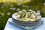 Tagliatelles-shaped zucchini,cheese and pine nut salad