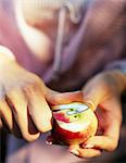 Woman peeling an apple