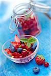 Bowl and jar of summer fruit