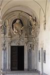 Naples. Certosa di San Martino doorway with baroque figure