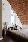 Brick vaulted ceiling in bedroom of carbon neutral home in Crossway, Kent, England. Architects: Hawkes Architecture