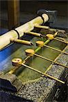 Water trough at Yasaka shrine at dusk, Kyoto, Japan