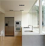 Modern kitchen with white fitted units. Architects: Found Associates