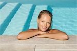 Woman relaxing in pool, portrait