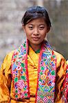 Young woman in colourful national dress at the Wangdue Phodrang Tsechu, Wangdue Phodrang Dzong, Wangdue Phodrang (Wangdi), Bhutan, Asia