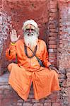 Sadhu (Holy Man) wearing brightly coloured clothing and characteristic facial painting at Pashupatinath Temple, Kathmandu, Nepal, Asia