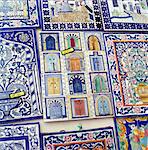 Tiles decorated with Tunisian doorways on souvenir stall, Hammamet, Cap Bon, Tunisia, North Africa, Africa