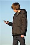 Teenage Boy using Cell Phone, Rogues, France