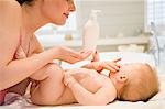 Mother and naked baby, skin care
