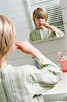 Boy brushing his teeth