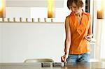 Young woman lighting candles