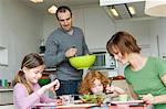 Couple and 2 little girls having lunch