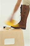 Woman polishing boots, close-up