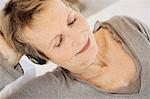 Senior woman listening to music with headphones