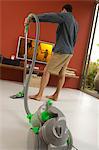 Man vacuuming, indoors