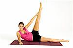 Portrait of a young woman exercising on an exercise mat