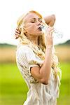 Young woman drinking water from a bottle