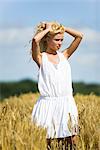 Young woman in wheat field