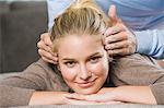 Mid section view of a man rubbing temples of a woman