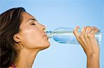 Woman drinking water from a water bottle