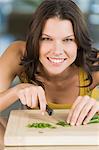 Woman chopping chives