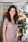 Woman standing in front of a refrigerator