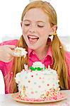 Girl eating birthday cake