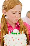 Girl eating birthday cake