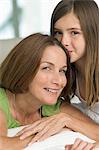 Girl kissing her grandmother