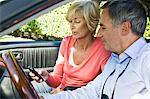 Couple in a car and text messaging