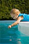 Baby boy playing with water