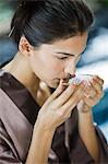 Woman smelling bath salt